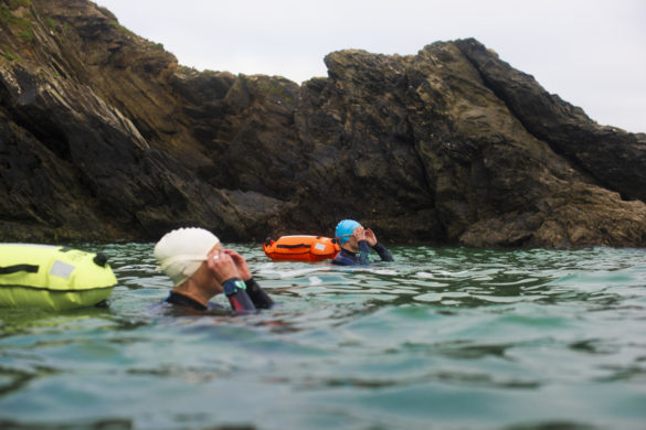 two swimmers preparing for a trek out in the gannel